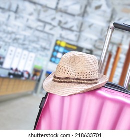 suitcase and hat 