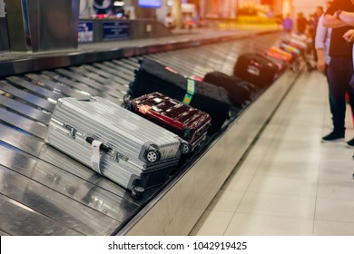 Suitcase Or Luggage With Conveyor Belt In The Airport.