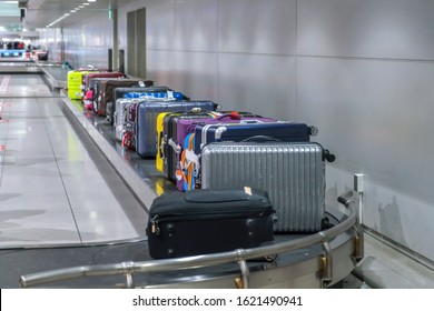 Suitcase Or Luggage With Conveyor Belt In The Airport.