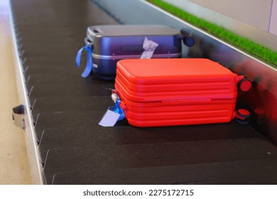 Suitcase or luggage with conveyor belt in the airport. - Shutterstock ID 2275172715