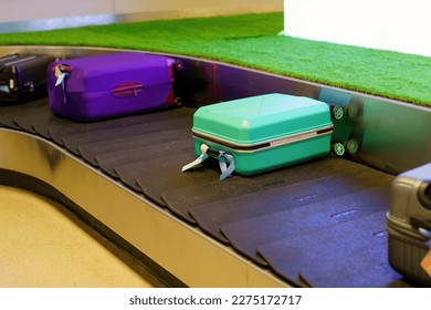 Suitcase or luggage with conveyor belt in the airport. - Shutterstock ID 2275172717