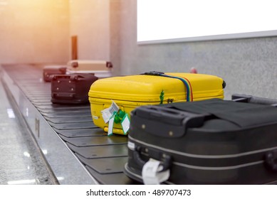 Suitcase Or Luggage With Conveyor Belt In The Airport.