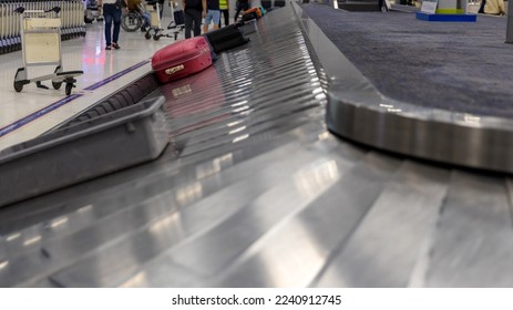 Suitcase or luggage with conveyor belt in the international airport. Luggage on the belt in the airport	 - Shutterstock ID 2240912745