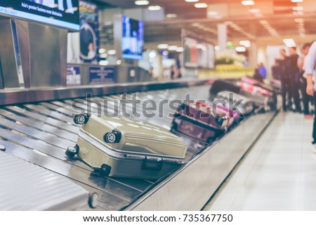 Suitcase or luggage with conveyor belt in the international airport.