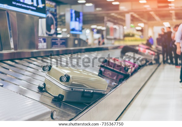 Suitcase or luggage with conveyor belt in the\
international airport.