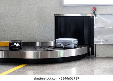 Suitcase luggage on conveyor belt - Shutterstock ID 2344606789