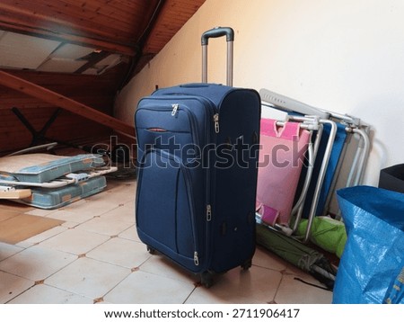 Suitcase, old things in attic. Objects of house. Cleanliness and tidiness of the house. 