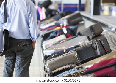 Suitcase On Luggage Conveyor Belt In The Baggage Claim At Airport