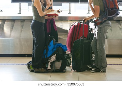 Suitcase On Luggage Conveyor Belt In The Baggage Claim At Airport