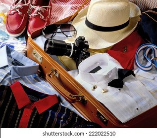 SUITCASE PACKED WITH CLOTHES