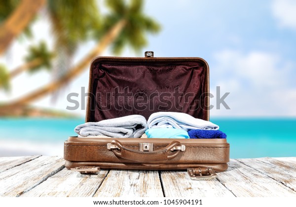 Suitcase of summer time\
and travel time 