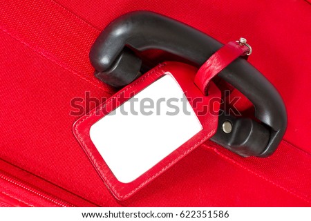 Suitcase Tag, Empty Travel Luggage Label on Handle, Red Baggage Bag Close up