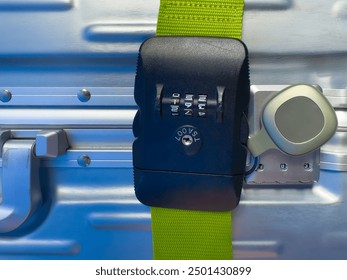 Suitcase, TSA belt and accepted code lock suitcase. Number combination. Smart tag GPS tracker ios or android in front. Travel and luggage handling. Anti loss app, security and assurance. Holiday. 