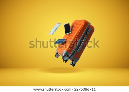 	
suitcase with yellow background and empty space for text shades of yellow background
