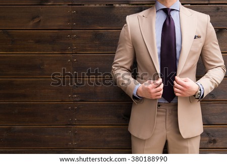 Suited man posing