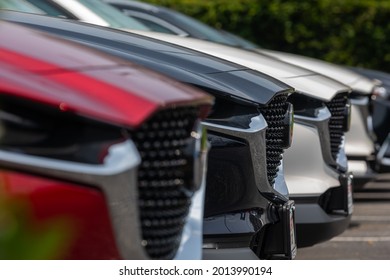 Suitland, Maryland, USA - 15 July 2021: Sideview of several Mazda Cars Front Hood on Sale at a Dealership, shallow Depth of Field