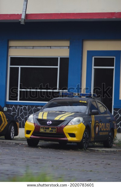 Sukabumi, West Java, Indonesia - September 22, 2020:\
Indonesian police car parked in front of a guard post in Sukabumi\
city