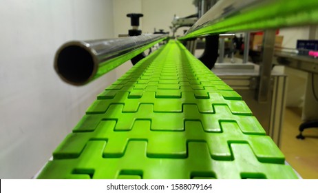 Sukabumi-Indonesia, December 2019. Teflon Chain Conveyor, On An Inline Machine.  At The Factory