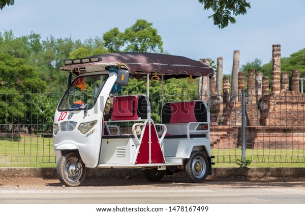 Sukhothai\
province,Thailand -August 2019 - New tuk-tuk used battery engine\
for safe noise pollution and low carbon dioxide, change and use for\
service tourism in Sukhothai National\
park