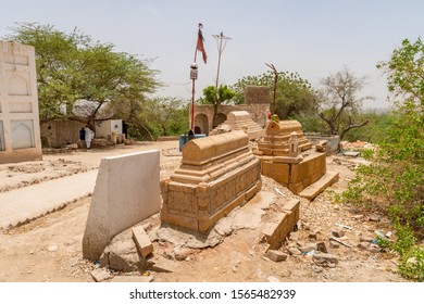 SUKKUR, PAKISTAN - JUNE 2019: Adam Shah Ji Takri Mausoleum Picturesque View Of Stone Graves On A Sunny Blue Sky Day