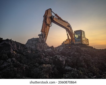 Sukoharjo - Indonesia - 10 - 20 - 2021
Photo Of Excavator Machine On Soil Mound.