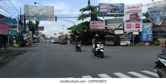 SUKOHARJO, INDONESIA--SEPT 8, 2022: Traffic Flow At The Gentan Traffic Light Intersection, Sukoharjo, Central Java Runs Smoothly