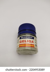 Sukoharjo. September 22, 2022. A Bottle Of Geliga Muscle Balm With A Tube Cap On A Dark Blue Color On A White Background.