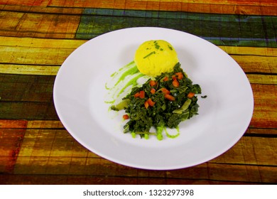 Sukuma  Wiki With Ugali On White Plate.