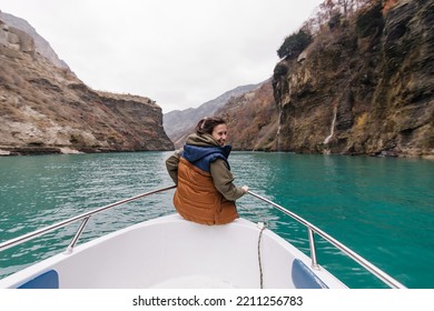 Sulak Canyon Dagestan In Autumn. Beautiful Mountain Nature View. Mood To Travel. New Experience . Blue Mountain River.  Bottom View. Boat Trip. A Woman Rides A Boat And Admires The View