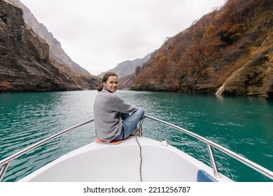 Sulak Canyon Dagestan In Autumn. Beautiful Mountain Nature View. Mood To Travel. New Experience . Blue Mountain River.  Bottom View. Boat Trip. A Woman Rides A Boat And Admires The View