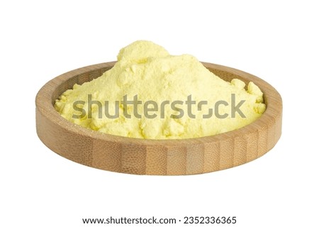 sulfur powder in a wooden bowl