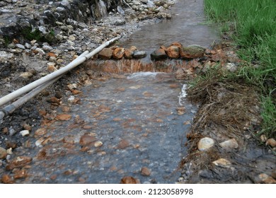 Sulfur Water Mixed With Rainwater Flows In A Small River