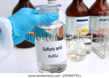 Sulfuric acid in containers, Hazardous chemicals and raw material, chemical in industry or laboratory