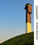 Sullivans Island Lighthouse with wildflowers and moon.