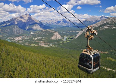 Sulphur Mountain Gondola Cable Car In Banff National Park In The Canadian Rocky Mountains Overlooking The Town Of Banff. The Mountain With The Hot Springs. Perfect Image For Travel And Tourism.