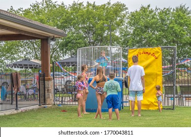 Sulphur Springs, TX, USA - July 4, 2020 - Friends Play With A Dunking Booth At A July 4 Celebration Cookout.