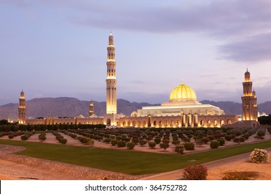 The Sultan Qaboos Grand Mosque illuminated at dusk. Muscat, Oman, Middle East