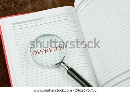Summary Description Conclusion Concept. Overview word through a magnifying glass in the notebook of a businessman, manager, teacher