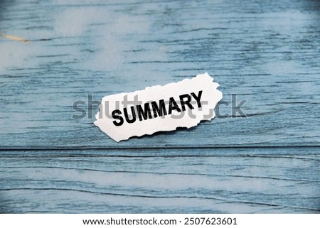 summary wording  or text on small piece of hard white plastic with blue background.Copy space and business concept.