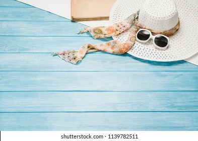 Summer accessories, vacation, travel, holiday top view background. Female accessories assortment. Womans hat and frame composition. Summertime and tourism concept - Powered by Shutterstock