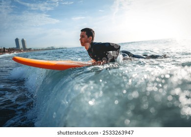 Summer adventure water sports concept. Happy carefree man surfing, living healthy active lifestyle - Powered by Shutterstock