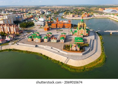 Summer aerial view of architectural ensemble of Republic Square and Blessed Virgin Mary on bank of Malaya Kokshaga river in Yoshkar-Ola overlooking Annunciation Cathedral and Tower, Mari El, Russia