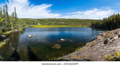 Summer afternoon at Cameron River Day Use Area in Hidden Lake Territorial Park, Northwest Territories, NT Canada - Shutterstock ID 2351022099