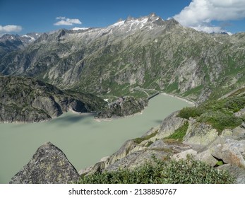 Summer Alpine landscape of Grimselsee lake with sharp peaks, Grimsel Pass, Switzerland - Shutterstock ID 2138850767