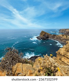 Summer Atlantic ocean rocky coastline scenery (near Arrifana Beach, Aljezur, Algarve, Portugal).