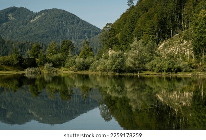 Summer atmosphere at Lake Lödensee in the Bavarian alpine upland beside Rupolding with view from lakeside and mountain panorama landscape in background - Shutterstock ID 2259178259
