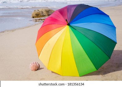 5,056 Rainbow umbrella on beach Images, Stock Photos & Vectors ...