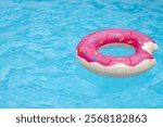 Summer background. Ring float in swimming pool. Summer background. Summer backdrop. Summertime vacation. Rubber circle. Inflatable swimming ring. Toy for water.