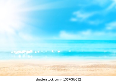 Summer background. Sea sand sun. Blur tropical beach with bokeh light wave abstract . Copy space of outdoor holiday vacation and travel adventure concept. Vintage tone filter effect color style.