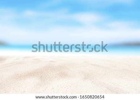 Summer background. Sea and sand, sunlight The tropical beach is blurry with abstract bokeh. Copy space for holiday makers and concepts.